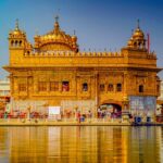Golden Temple Amritsar reflecting in Sarovar at sunrise