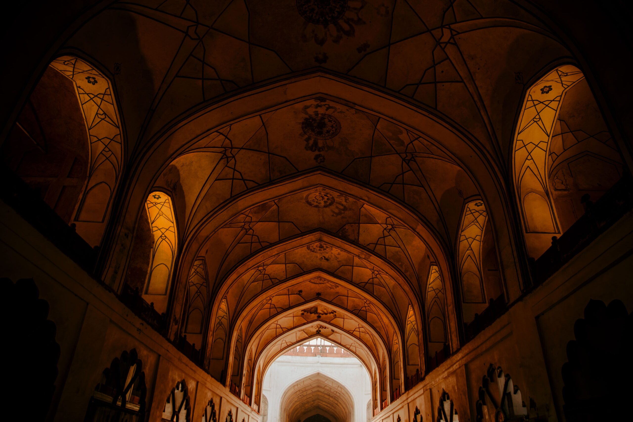 Inside view of Red Fort's artistic arches showcasing Mughal architecture in New Delhi, India.